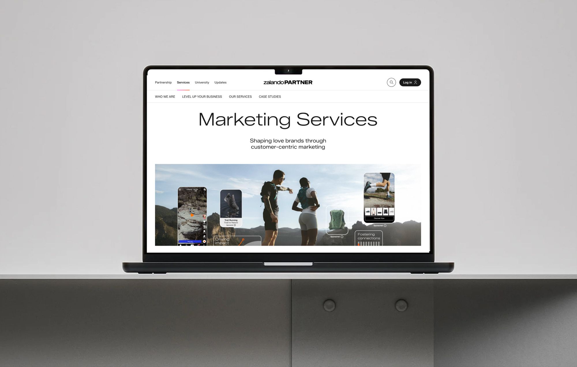 Laptop showing the Zalando Partner marketing services webpage with athletes running in the header image.