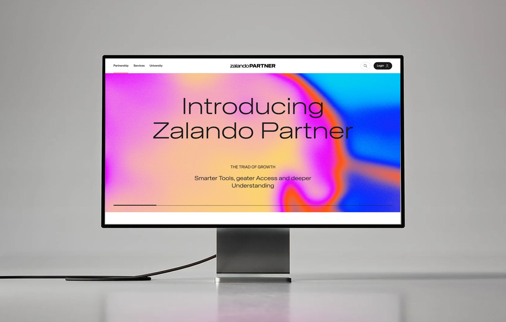 Desktop monitor displaying the Zalando Partner website introduction with a colorful gradient background.